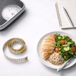 why crash diets fail illustrated with weighing scale and restrictive meal plan notebook